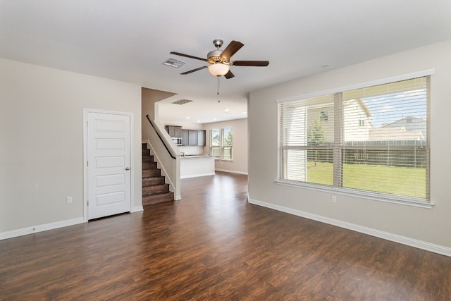 unfurnished room featuring ceiling fan and dark hardwood / wood-style floors