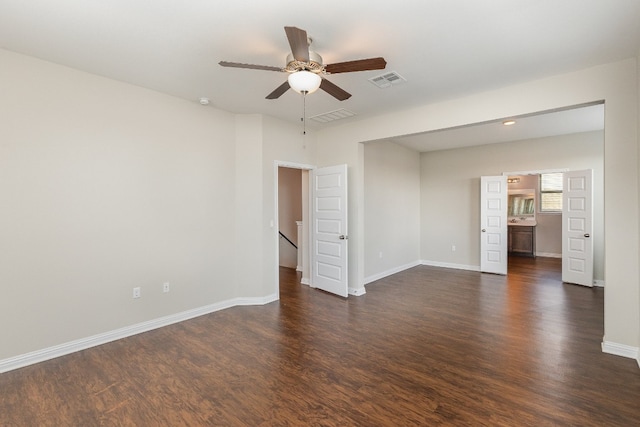 interior space with ceiling fan and dark hardwood / wood-style floors