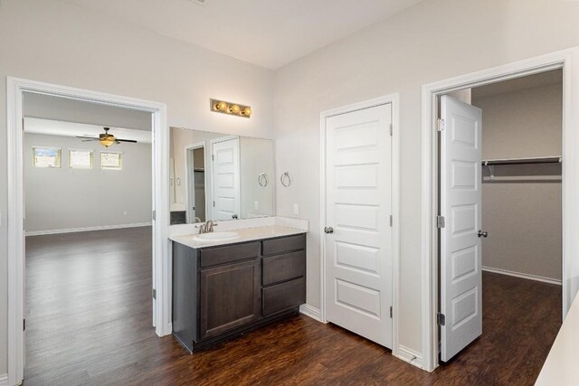 bathroom with vanity, hardwood / wood-style flooring, and ceiling fan