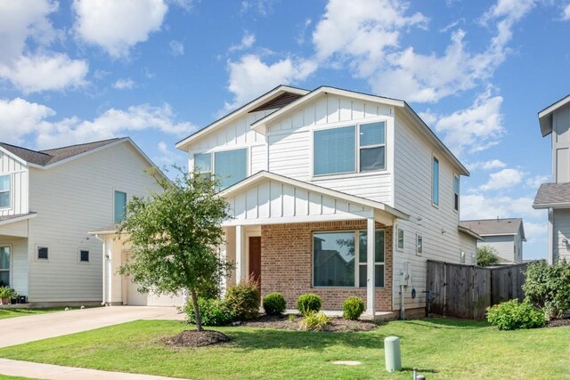 view of front of home with a garage and a front yard