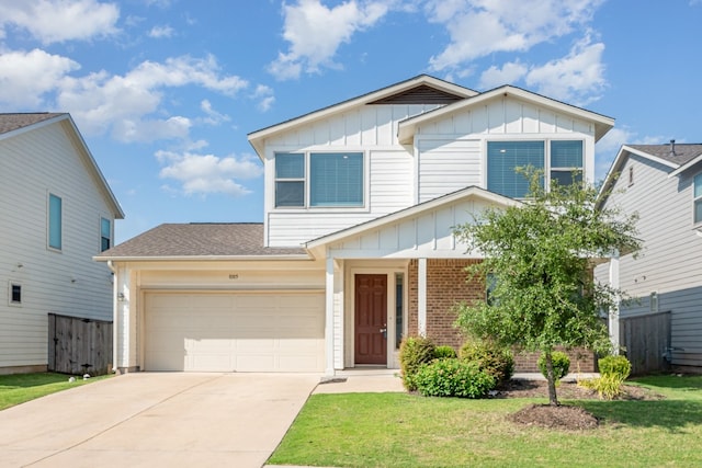 view of front of house with a garage and a front yard