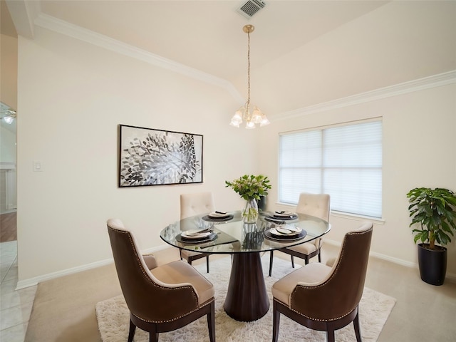 carpeted dining room with an inviting chandelier and ornamental molding