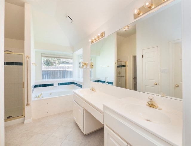 bathroom with tile patterned floors, independent shower and bath, vaulted ceiling, and vanity