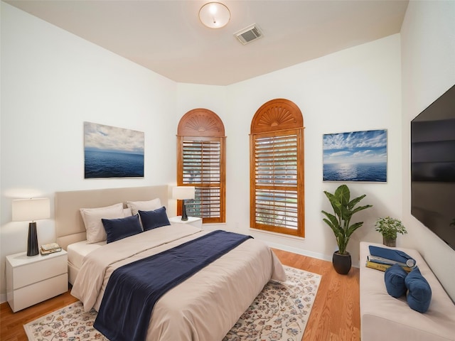 bedroom with light hardwood / wood-style floors