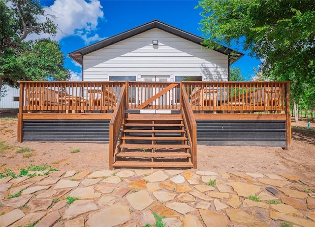 exterior space featuring a deck and a patio area