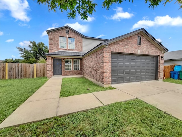 view of front of home featuring a front yard and a garage