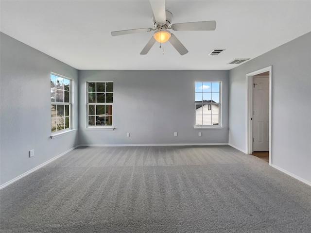 empty room with light colored carpet and ceiling fan