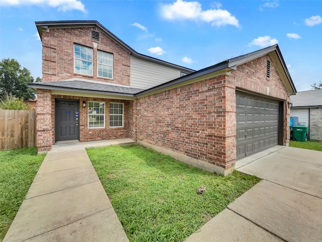 view of front of home featuring a garage and a front yard