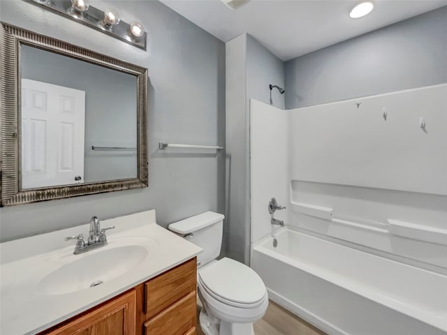 full bathroom featuring vanity, toilet, and shower / washtub combination