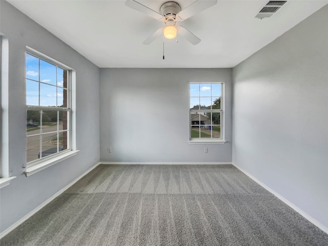 carpeted empty room with ceiling fan