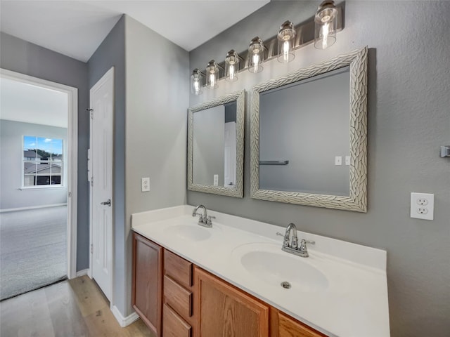 bathroom with vanity and hardwood / wood-style floors