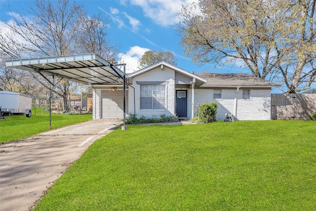 view of front facade with a carport, a front yard, and a garage