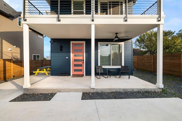 6217 Clovis St Unit B, Austin, TX 78741 - fenced backyard featuring a ceiling fan, a balcony, and a patio