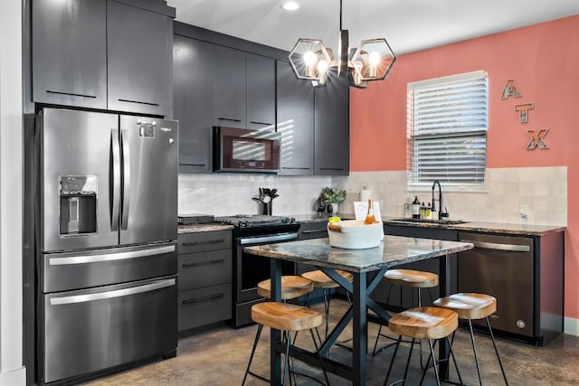 6217 Clovis St Unit B, Austin, TX 78741 - kitchen featuring stainless steel appliances, a sink, backsplash, a chandelier, and pendant lighting