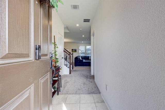 hallway with light tile patterned floors