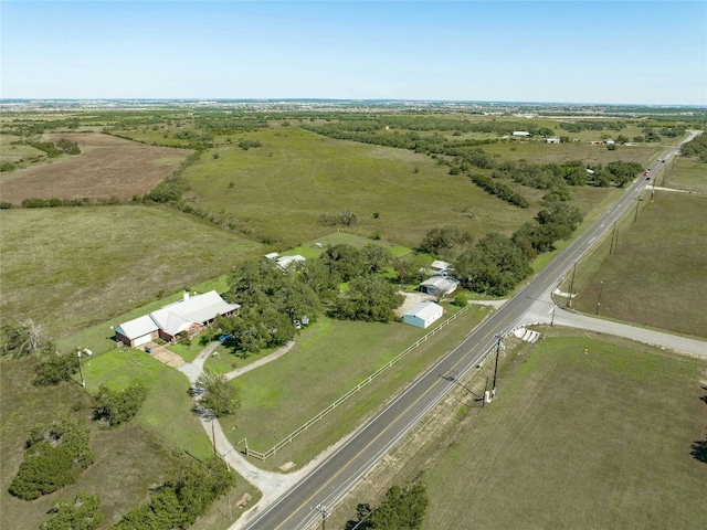 birds eye view of property with a rural view