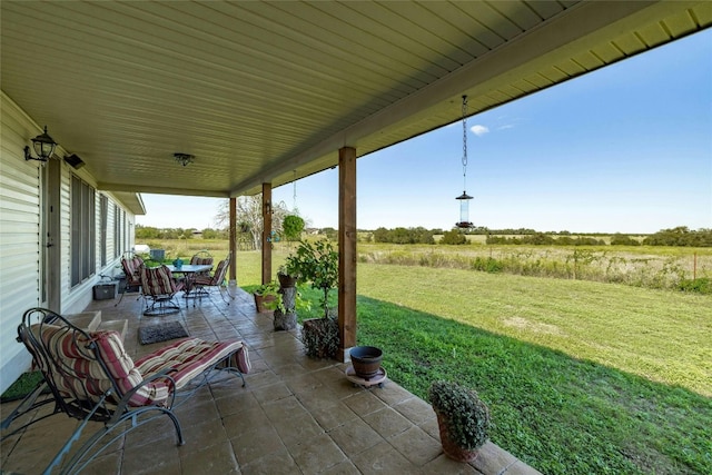 view of patio featuring outdoor dining area