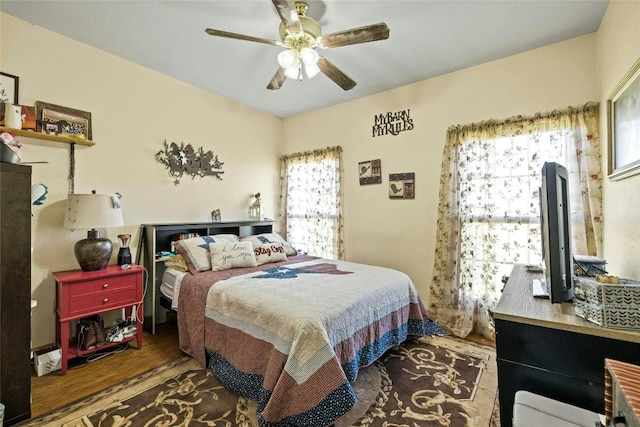 bedroom with wood finished floors and a ceiling fan