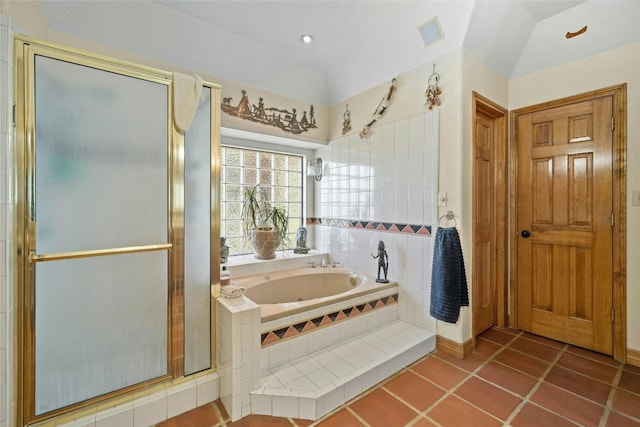 full bath with visible vents, lofted ceiling, tile patterned flooring, a shower stall, and a garden tub