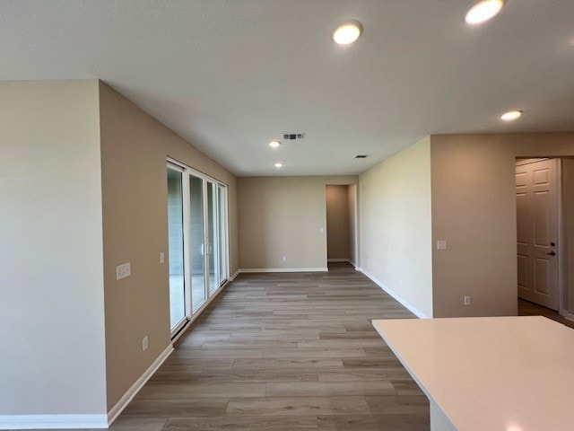 empty room with hardwood / wood-style floors