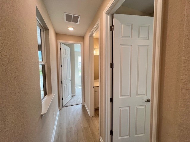 hallway featuring light hardwood / wood-style floors