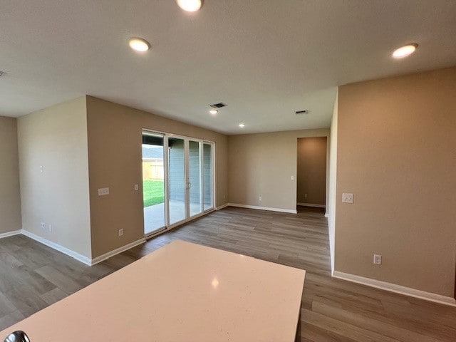 empty room featuring wood-type flooring