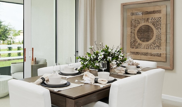 dining room featuring hardwood / wood-style flooring and a wealth of natural light