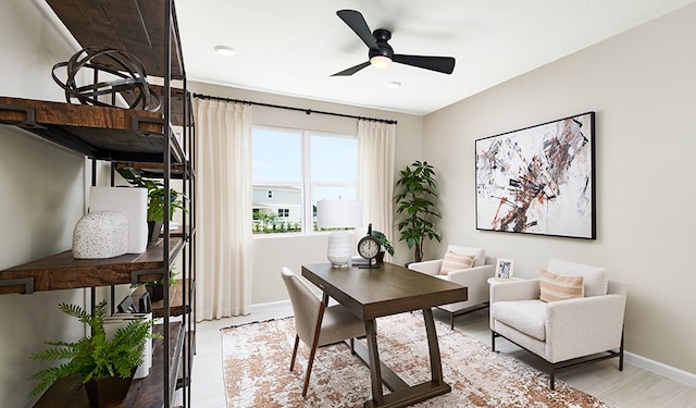 office space featuring ceiling fan and light wood-type flooring