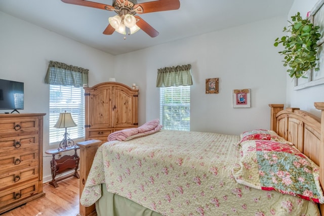 bedroom featuring light wood-type flooring and ceiling fan