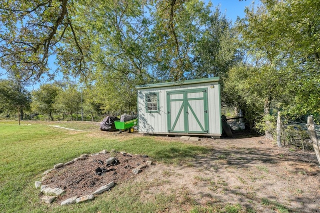 view of outbuilding with a lawn