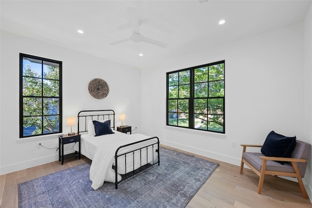 bedroom featuring ceiling fan and light hardwood / wood-style flooring