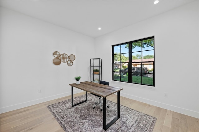 office area with light hardwood / wood-style flooring