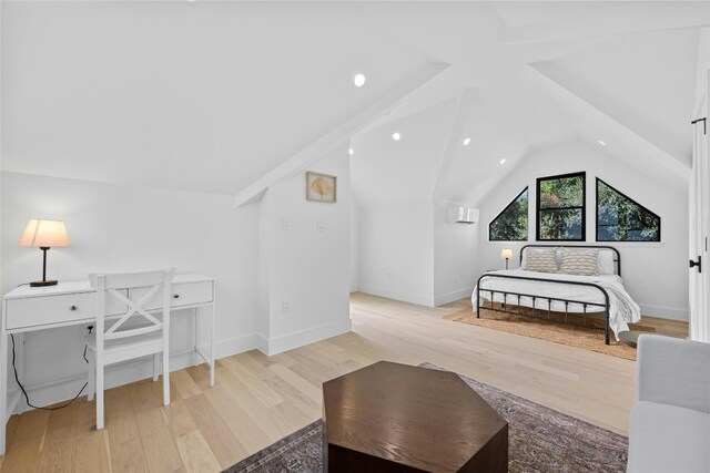 bedroom with light hardwood / wood-style flooring and vaulted ceiling