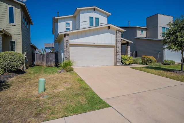 view of front facade with a garage and a front lawn