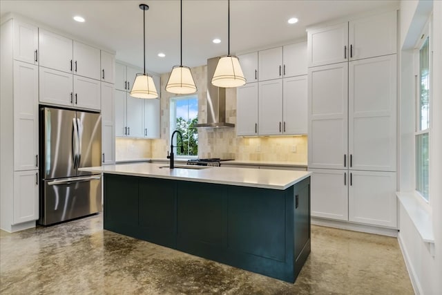 kitchen featuring appliances with stainless steel finishes, hanging light fixtures, and a wealth of natural light