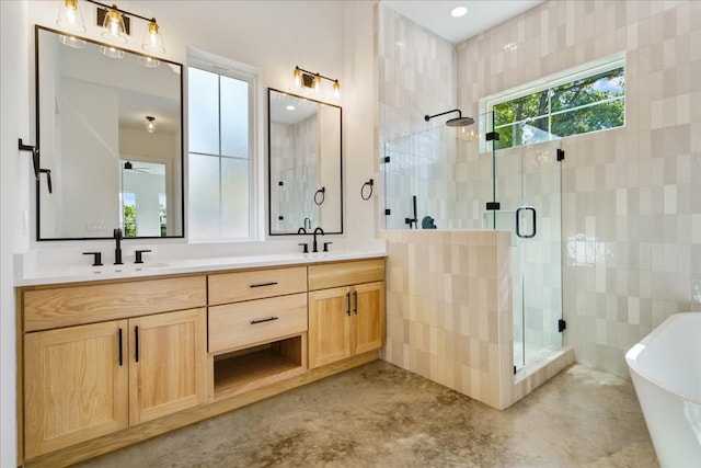 bathroom with vanity, independent shower and bath, and concrete flooring