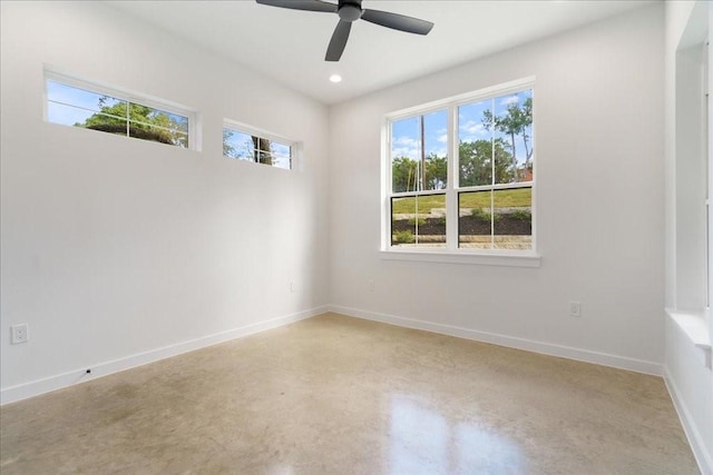 unfurnished room featuring a ceiling fan, baseboards, recessed lighting, and finished concrete floors