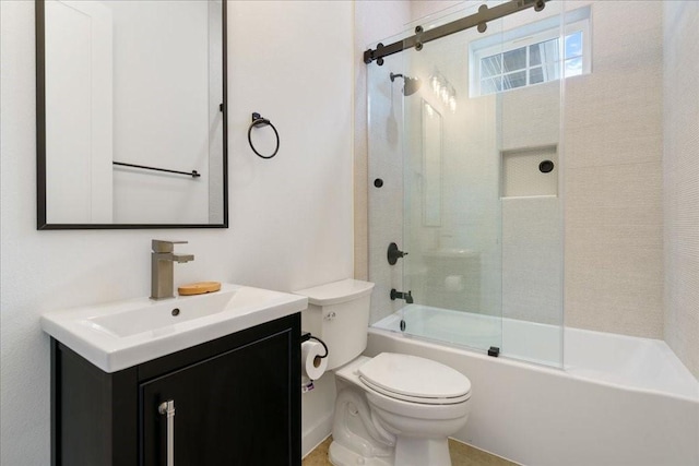 full bathroom featuring vanity, combined bath / shower with glass door, and toilet