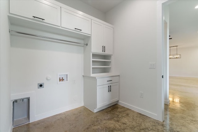 clothes washing area featuring washer hookup, hookup for an electric dryer, gas dryer hookup, and cabinets