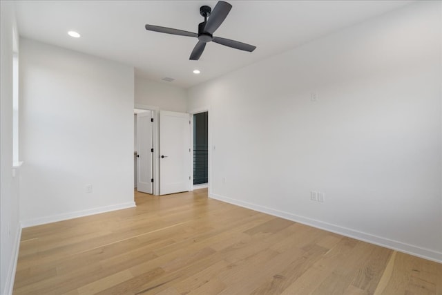 unfurnished room featuring light hardwood / wood-style flooring and ceiling fan