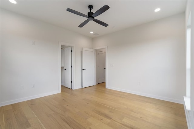 unfurnished bedroom with light wood-type flooring and ceiling fan