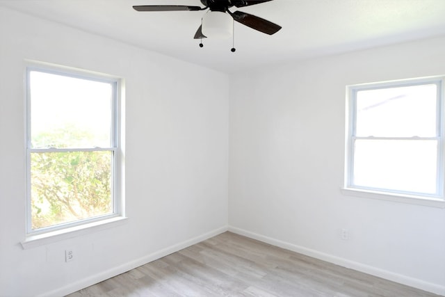 empty room featuring ceiling fan and light hardwood / wood-style floors