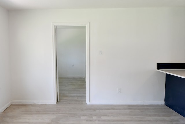 spare room featuring light hardwood / wood-style flooring