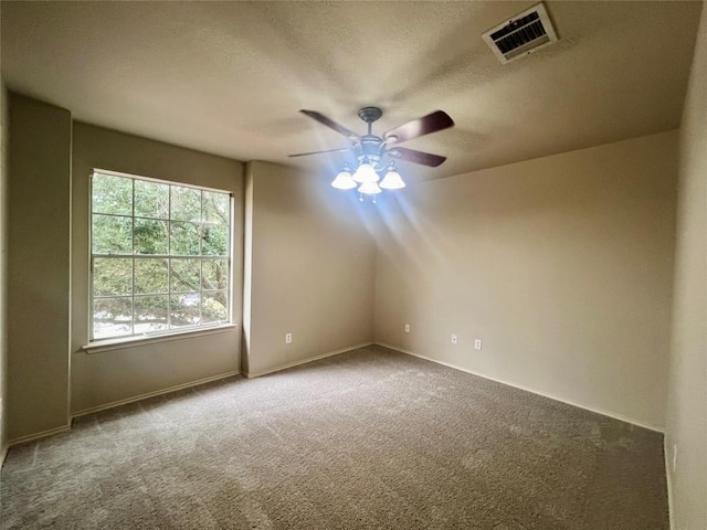 unfurnished room featuring carpet and ceiling fan