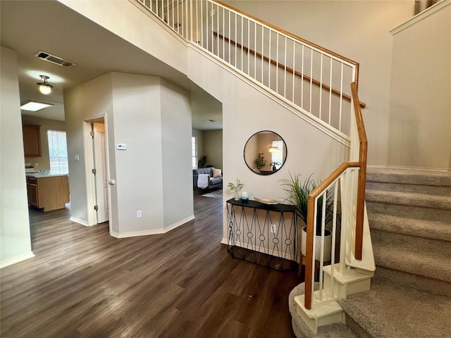 stairway with hardwood / wood-style flooring