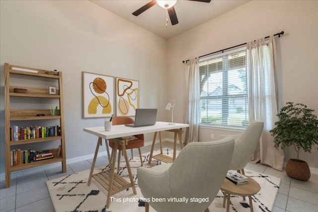 tiled home office with vaulted ceiling, ceiling fan, and baseboards