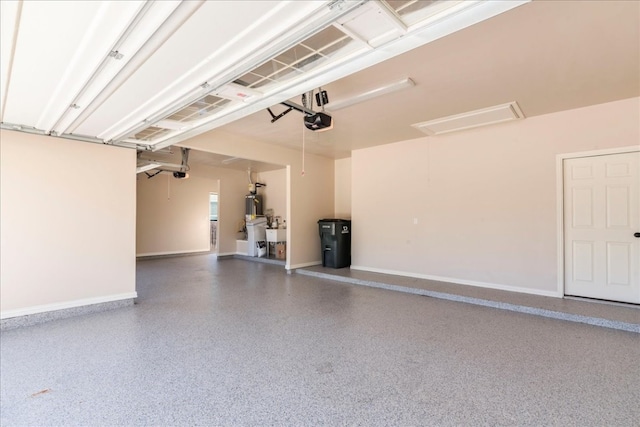 garage with baseboards and a garage door opener