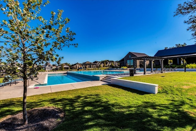 pool featuring a yard and a pergola