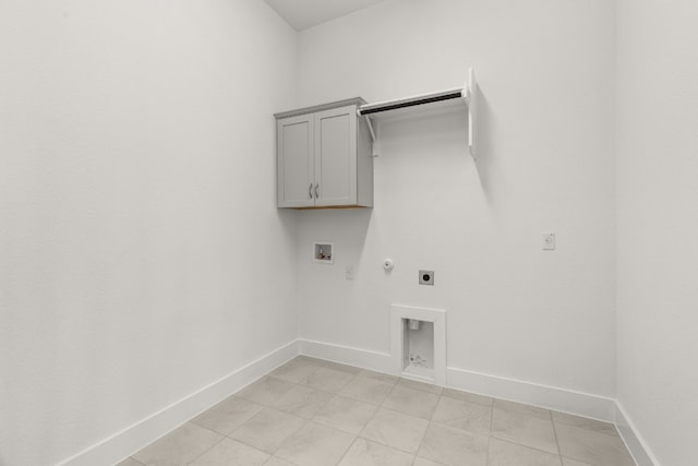 laundry area with cabinets, hookup for a gas dryer, hookup for a washing machine, and electric dryer hookup