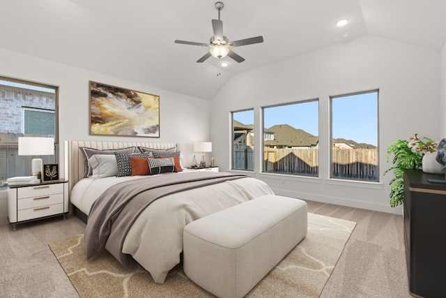 carpeted bedroom featuring vaulted ceiling and ceiling fan